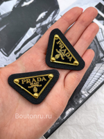 Логотип металлический Прад. на коже черный золото