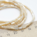 Перламутр тонированный, цвет бежевый, размер около 5*2,8 мм, цена за отрезок 36-37 шт (1/2 нити)