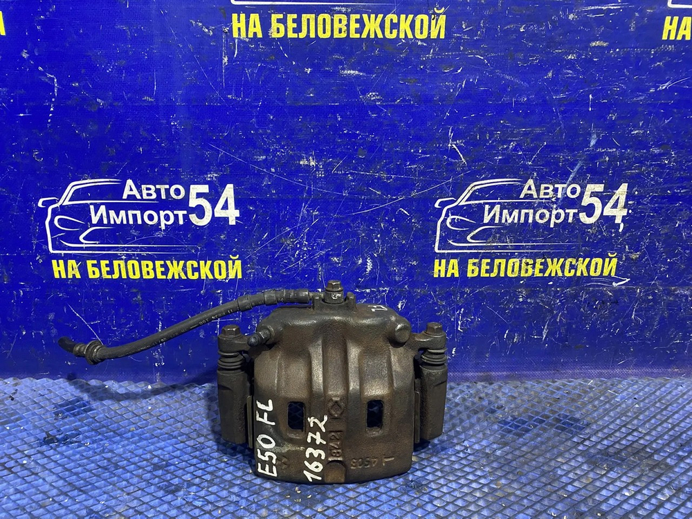 Суппорт тормозной передний левый NISSAN ELGRAND 1997-2002