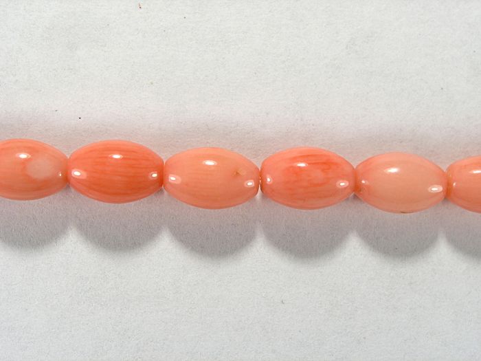 Бусина из коралла розового, облагороженного, фигурная, 6x9 мм (овал, гладкая)