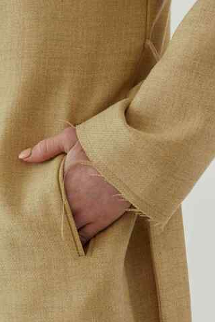 Плащ из бежевой шерсти