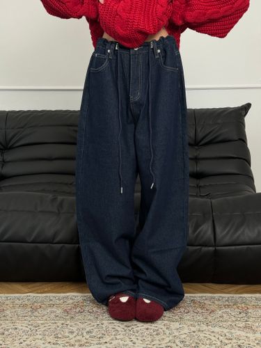 Широкие синие джинсы на кулиске