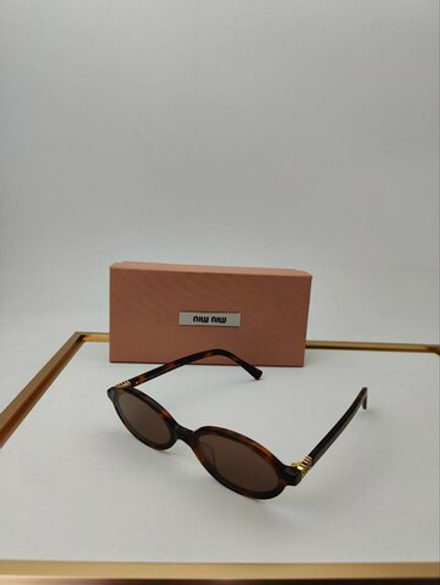 Солнцезащитные очки MIU MIU