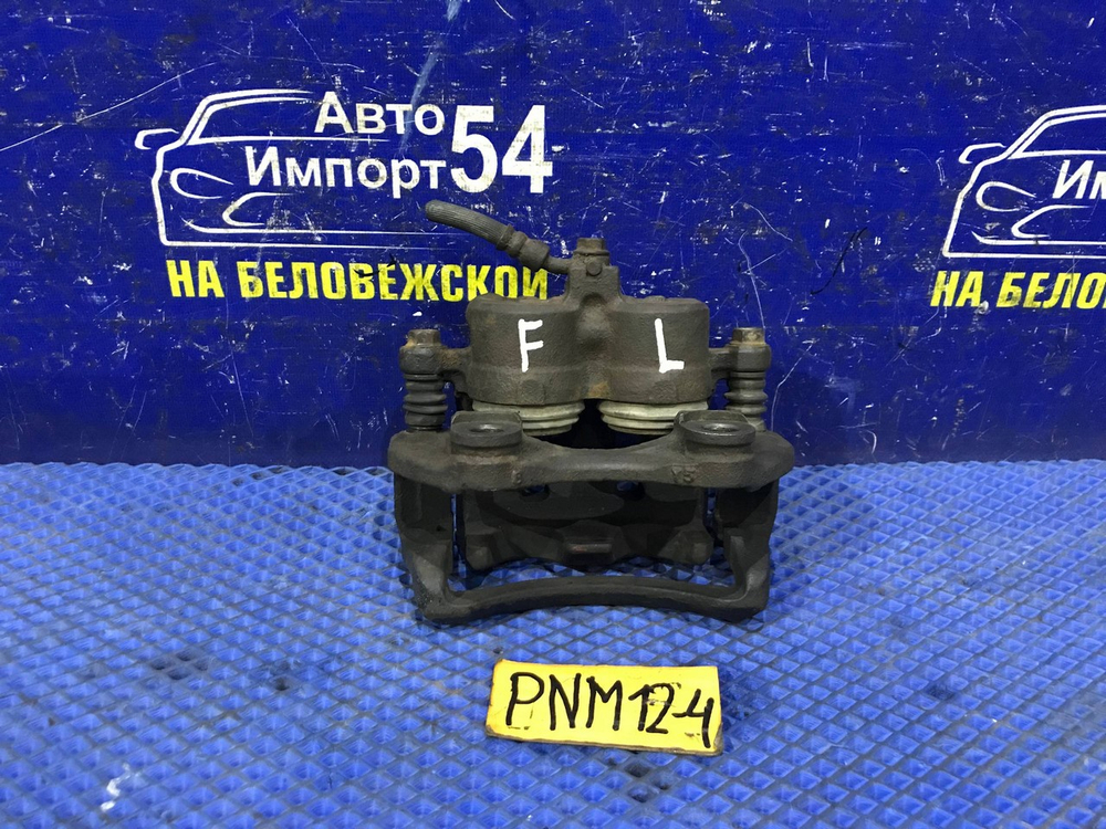 Суппорт тормозной передний левый NISSAN LIBERTY 1998