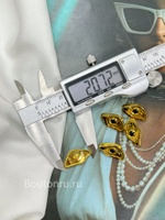 Пуговицы золотистые в форме глаза Скиапар.