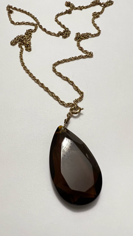 Кулон из коричневого стекла