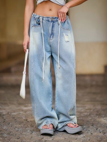 Голубые джинсы-трансформеры с потертостями