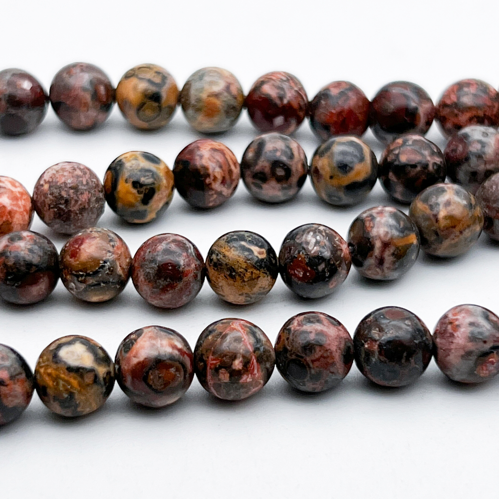 Риолит бусины, диаметр около 8-8,3 мм, цена за 21-22 шт (1/2 нити)