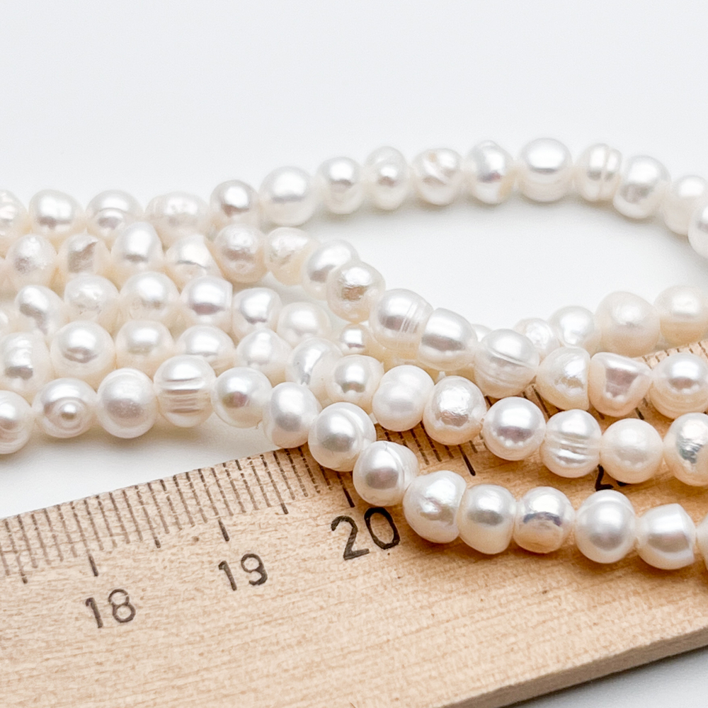 Жемчуг, размер около 4-4,5*5-5,8 мм, цена за нить 35 см