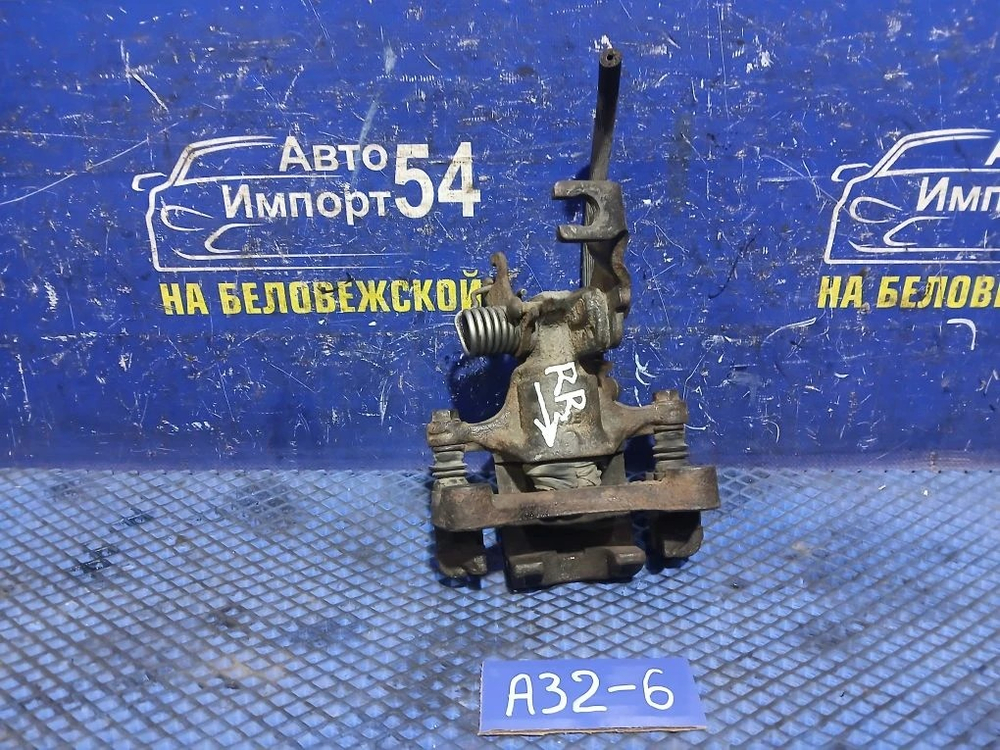Суппорт тормозной задний правый NISSAN CEFIRO 1994