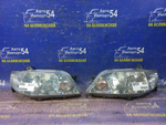 Фара передняя левая MAZDA FAMILIA 2000-2003