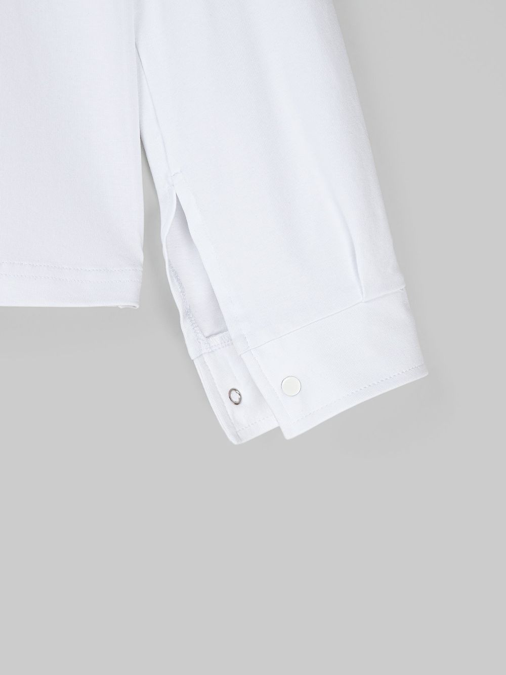 Блузка трикотажная для девочки "Белая" на кнопках 7+