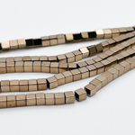 Гематит Куб бусины (имитация), цвет золотистый, размер около 2,9-3 мм, цена за отрезок 19 см (1/2 нити)