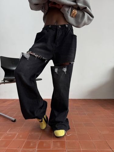 Черные рваные джинсы-трансформеры