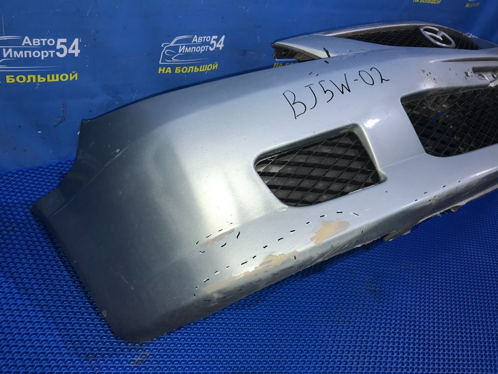 Бампер передний MAZDA FAMILIA 2001