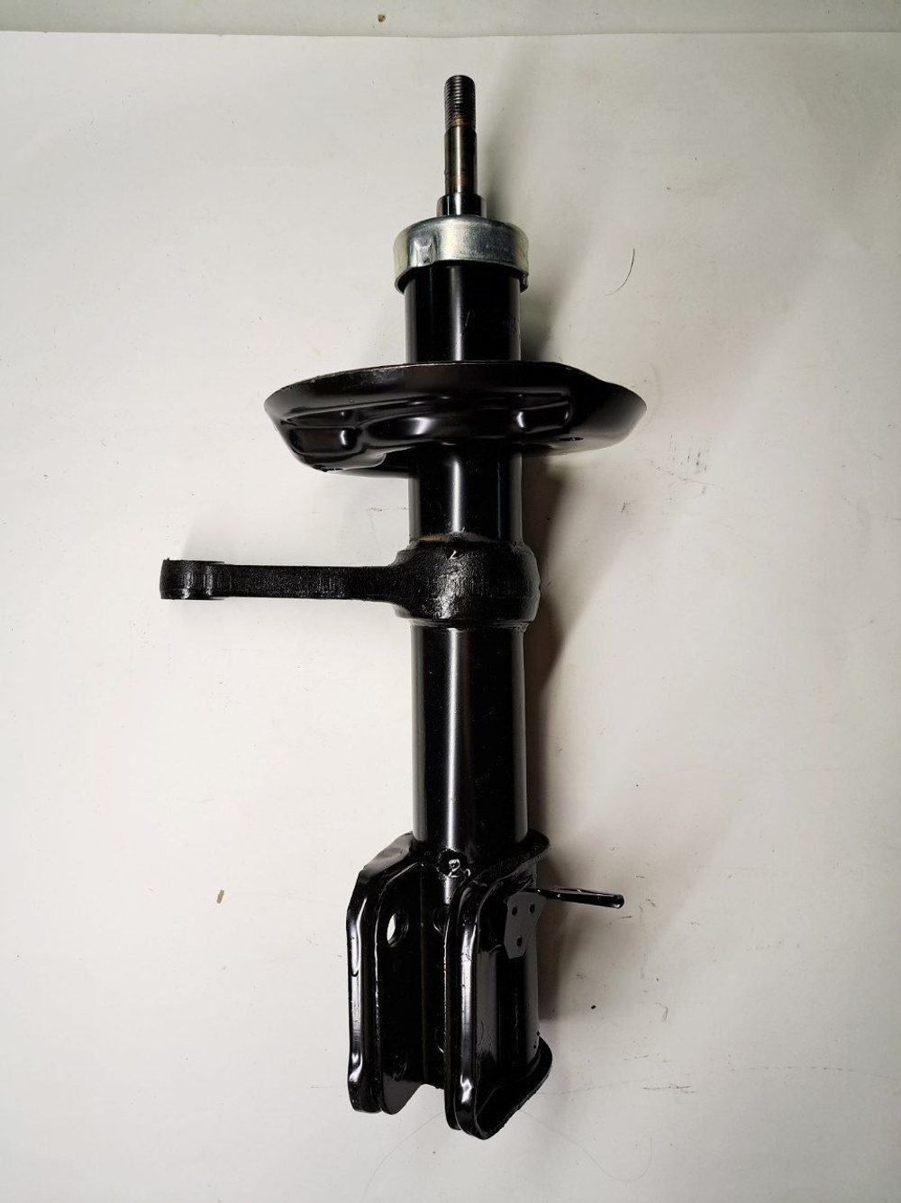 Стойка амортизатора передняя правая 1119-2905402 Птимаш