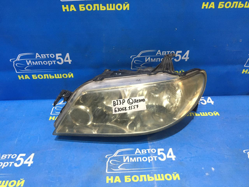 Фара передняя левая MAZDA FAMILIA 2000-2003