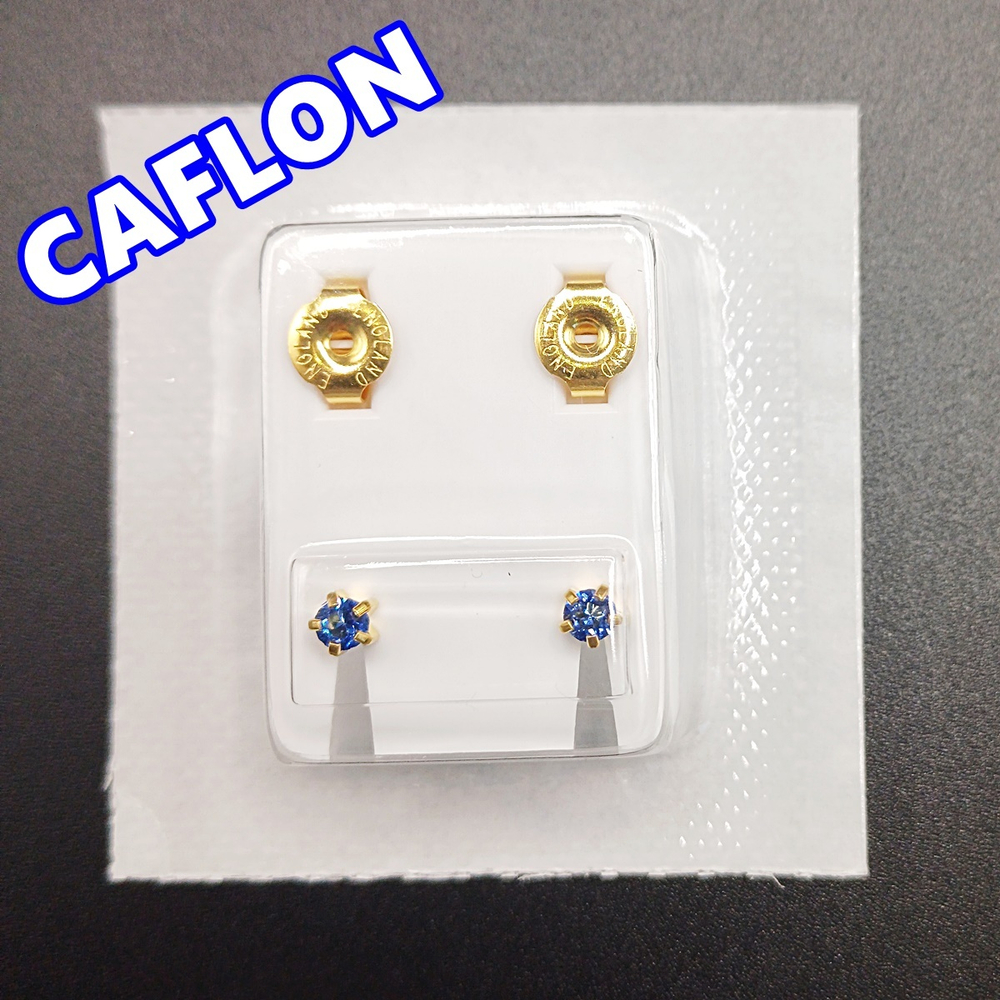 Серьги-гвоздики для прокола ушей под пистолет. CAFLON (Англия). Золотистые с синими ( Сентябрь) кристаллами, крапление