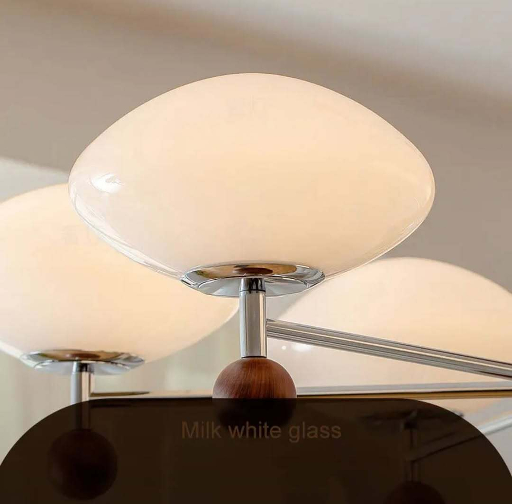 Этот светильник — стильная комбинация дерева, металла и матового стекла.