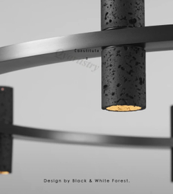 Подвесная люстра из чёрного травертина с кольцевой формой.