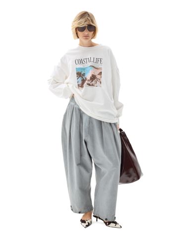 Серые хлопковые брюки-бананы с защипами