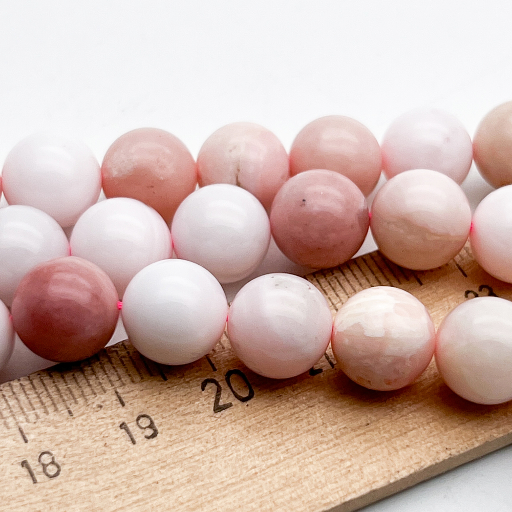 Опал розовый бусины, диаметр около 10,4-10,6 мм, цена за 9 шт (1/4 нити)