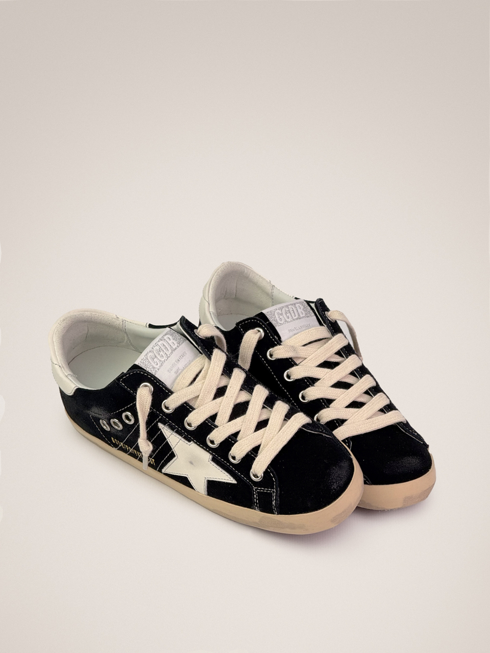 Super Star in black suede with with white leather star and heel tab