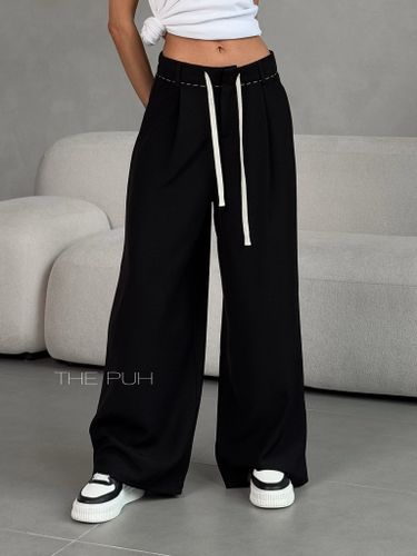 Женские брюки свободного кроя черного цвета