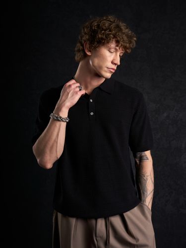 Черная трикотажная футболка-поло Laine New