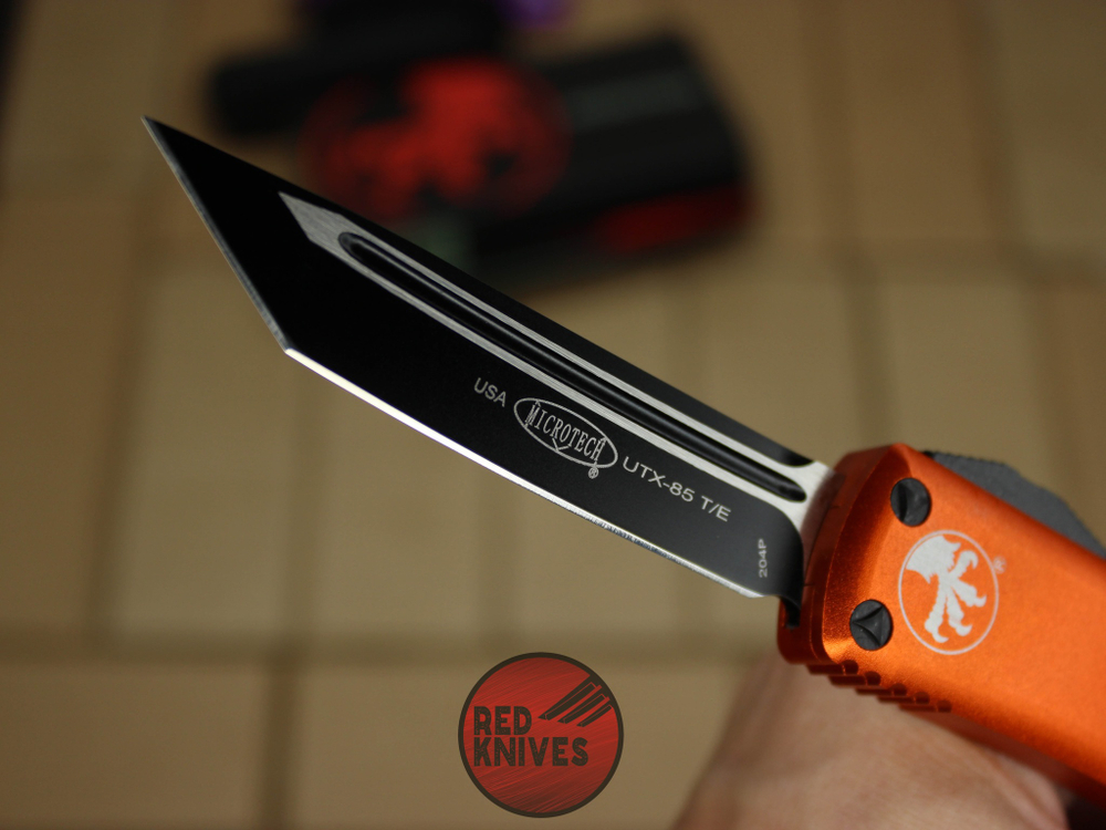 Нож Microtech UTX-85 T/E - оранжевая рукоять, танто клинок, черный RK-396