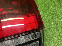 Фонарь левый внешний Toyota Land Cruiser 300 21-нв