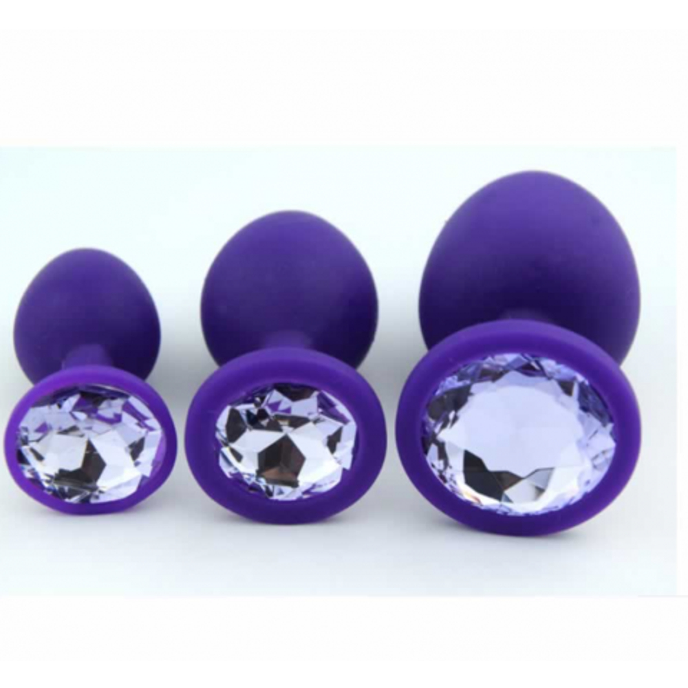 Анальная пробка из фиолетового силикона с жёлтым кристаллом (размер S)