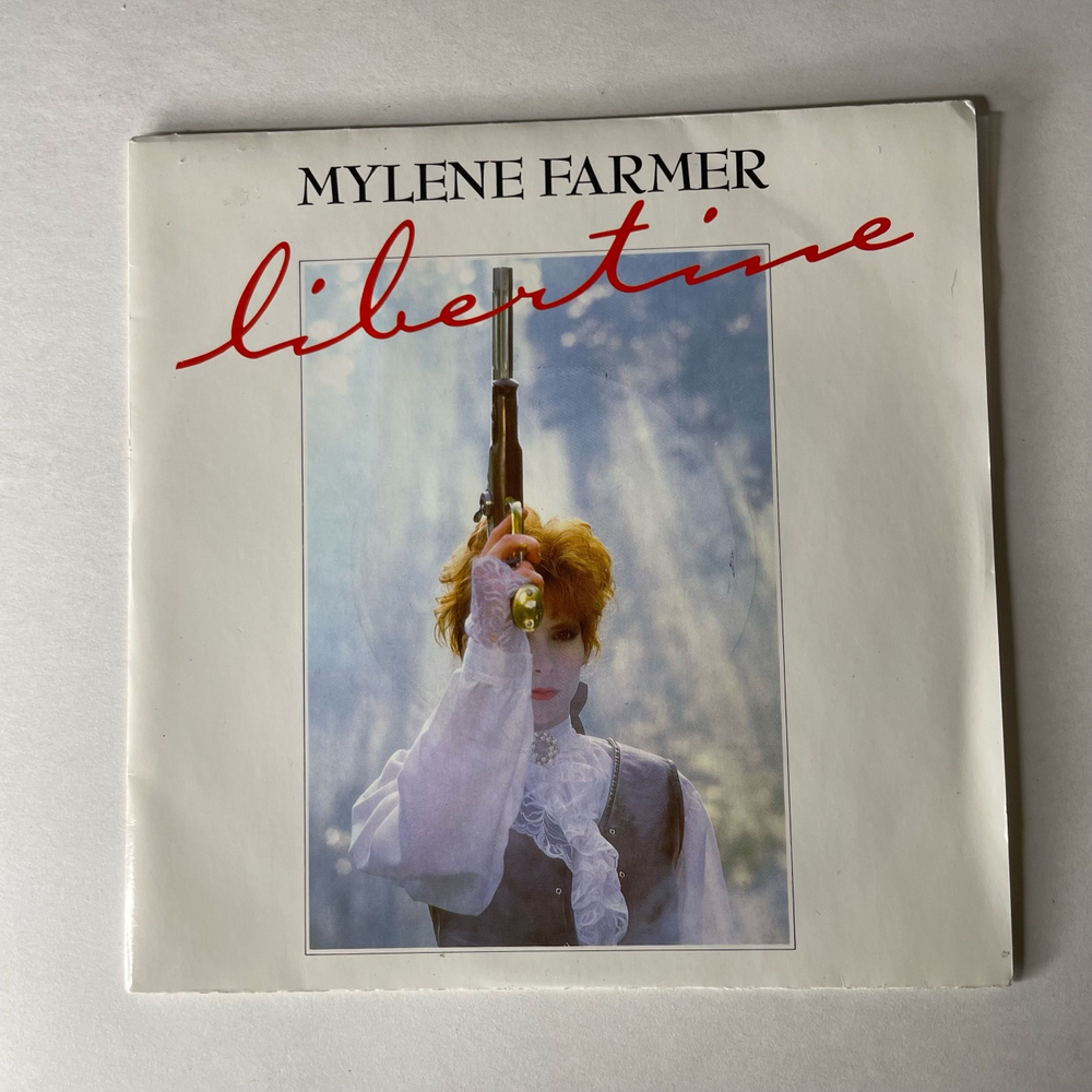 Винтажная виниловая пластинка 7 дюймов (маленькая пластинка) Mylene Farmer Libertine (Франция 1986)