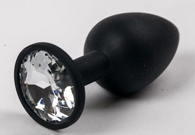 Черная силиконовая анальная пробка с прозрачным стразом - 7,1 см. (Цвет: прозрачный)