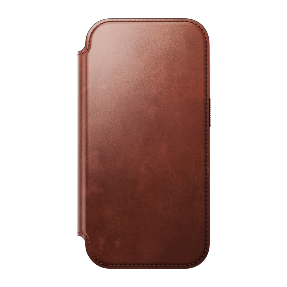 Кожаный чехол-книжка MagSafe Nomad Horween Modern Leather Folio Limited Edition для iPhone 17 Pro Гибридный укреплённый чехол из натуральной кожи Horween с сенсорной накладкой для Контроллера камеры. Есть отделение для купюр и встроенный картхолдер — вмещ