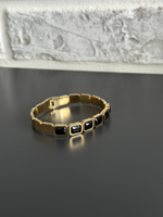 Браслет жесткий с черными кристаллами, оттенок золото. Размер 16-18. Родированный сплав.