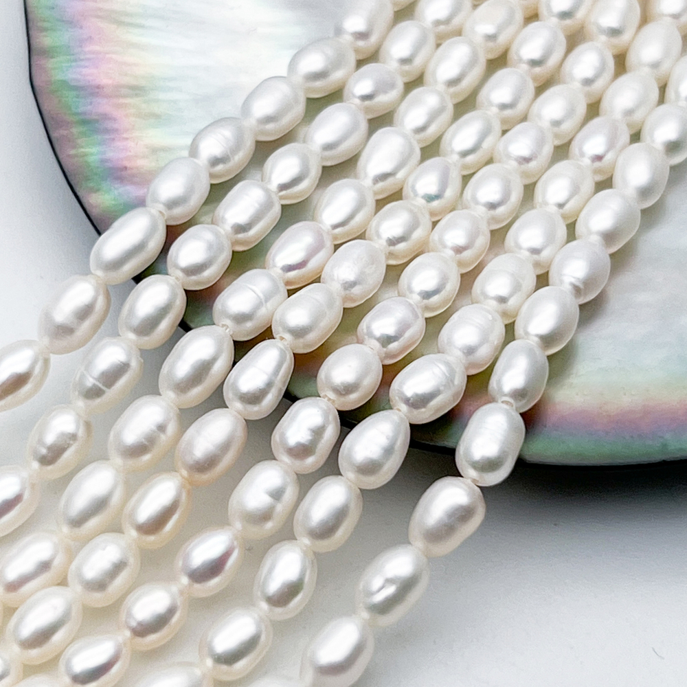 Жемчуг Рис бусины, размер около 5-6*4,5-5 мм, цена за отрезок 17 см (1/2 нити)