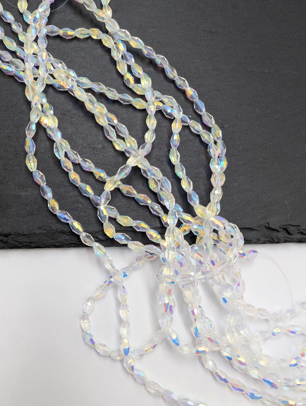 Бусины стеклянные рис 5.5*3.5мм, прозрачный АВ