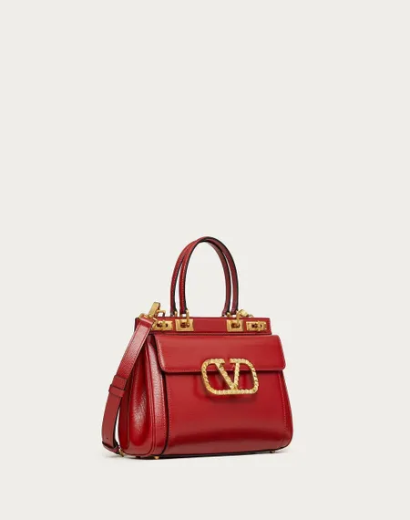 Средняя сумка с ручкой Valentino Rockstud Alcove из зернистой телячьей кожи красный