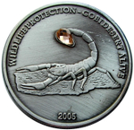 Жетон 500 тугриков Монголия 2005 года. Скорпион (белый камень). Красная книга.