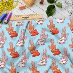 Ткань блэкаут золотые и белые рыбки на голубом фоне