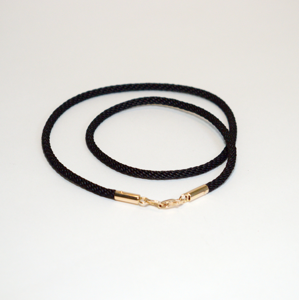 Гайтан с золотыми наконечниками.