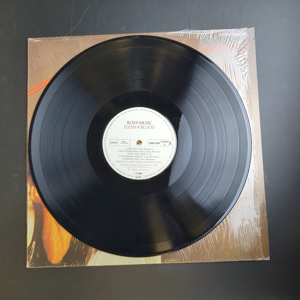 LP Roxy Music - Flesh + Blood Зарубежный рок. Виниловая пластинка 12 дюймов.Германия.1980 год. Конверт VG+ / Диск VG+