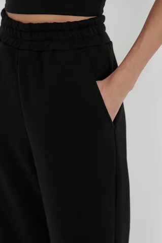 Утепленные брюки клеш черного цвета