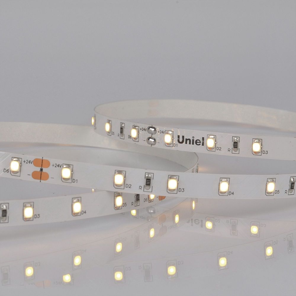 ULS-2835-60LED-m-8mm-IP20-DC24V-6W-m-5M-WW Гибкая светодиодная лента на самоклеящейся основе. Катушка 5 м. в герметичной упаковке. Теплый белый свет 3000K. ТМ Uniel.