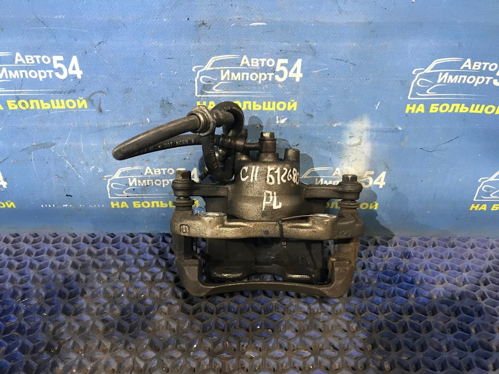 Суппорт тормозной передний левый NISSAN TIIDA 2004-2012