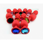 Анальная пробка из красного силикона со светло-жёлтым кристаллом (размер S)