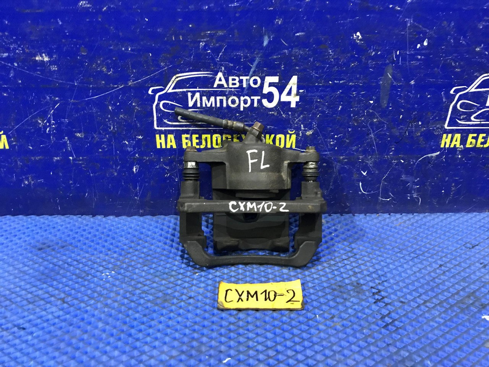 Суппорт тормозной передний левый TOYOTA IPSUM 1997