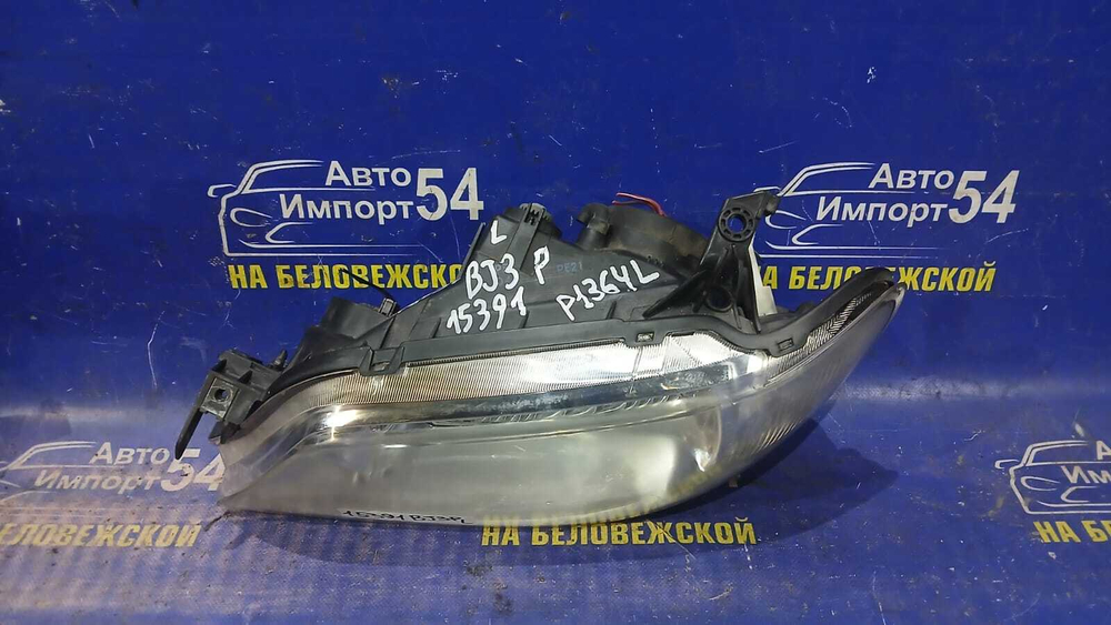 Фара передняя левая MAZDA FAMILIA 2000-2003