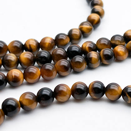 Тигровый глаз бусины, диаметр около 6-6,2 мм, цена за 30-31 шт (1/2 нити)
